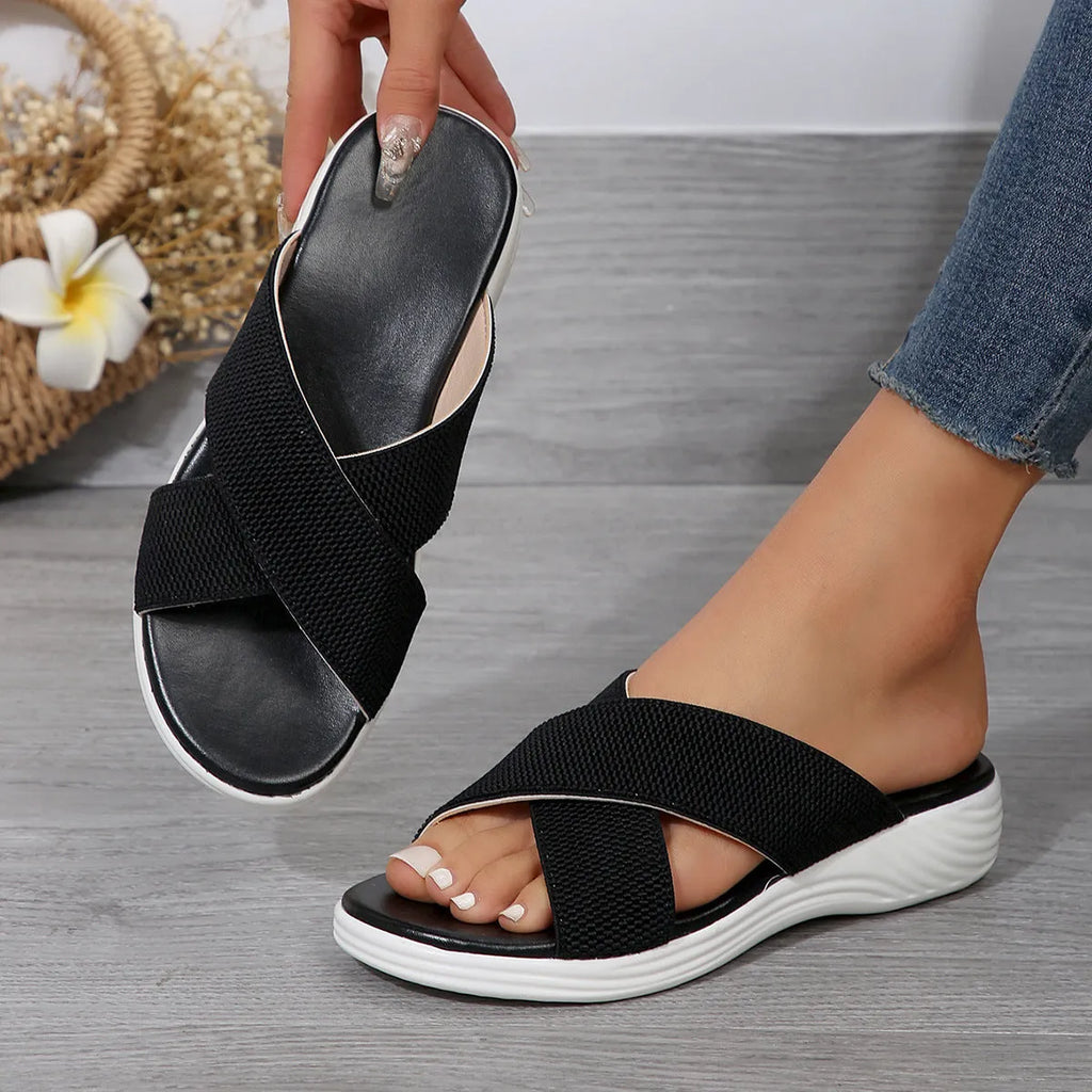 Women's black wedge slippers with cross strap and peep toe fish mouth design