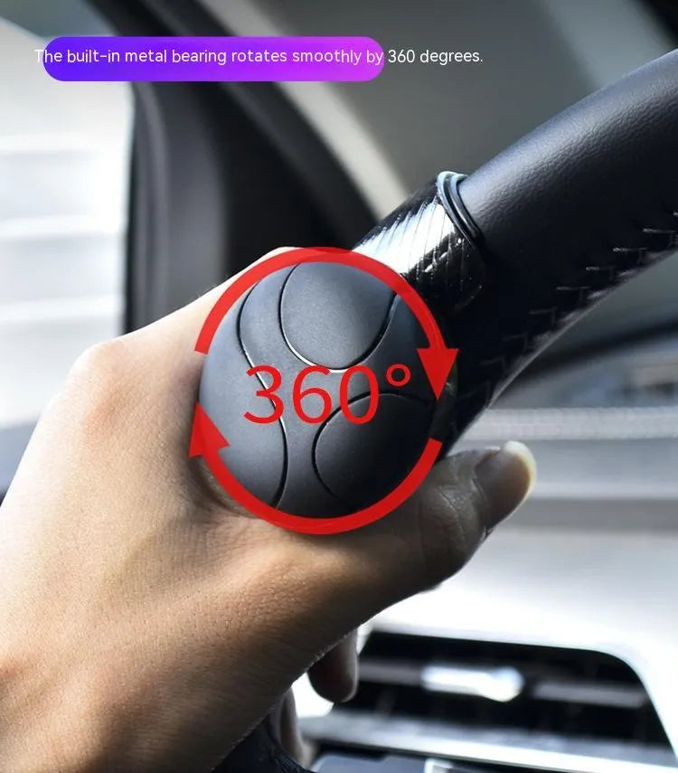 Black and blue silicone steering wheel assist balls with metal bearing boosters showing 9cm by 6cm dimensions