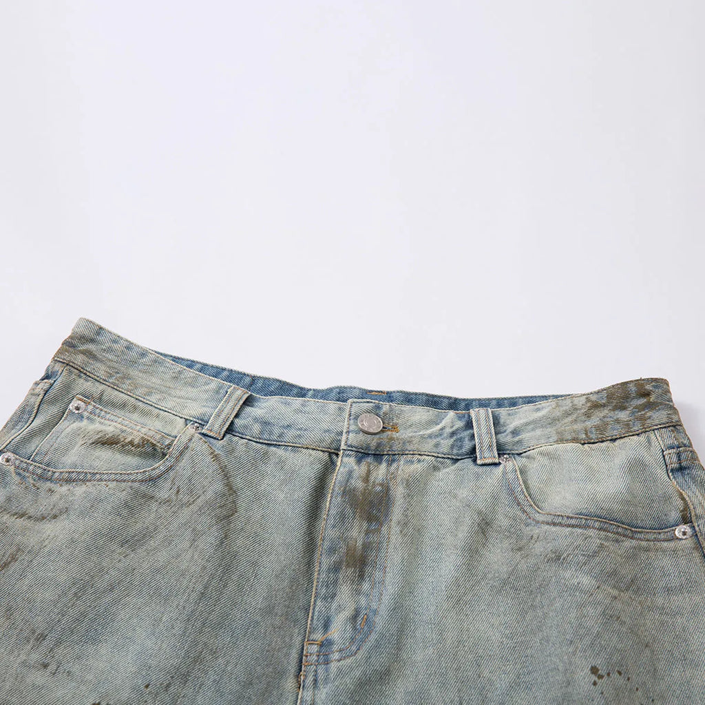 Washed blue straight-leg denim trousers with mid-length cut and zipper fly closure
