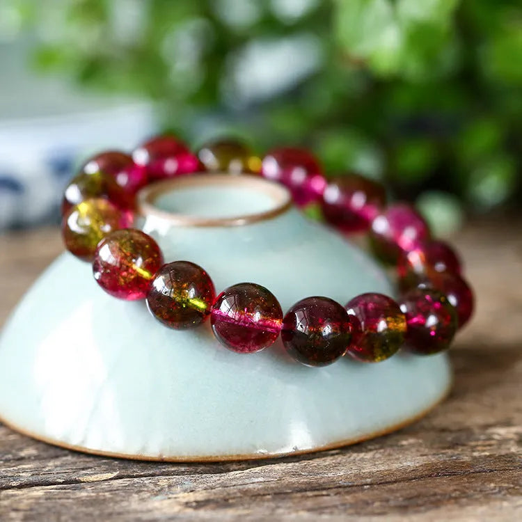 Women's watermelon crystal bracelet showing pink and green natural stone beads in selected size on wrist