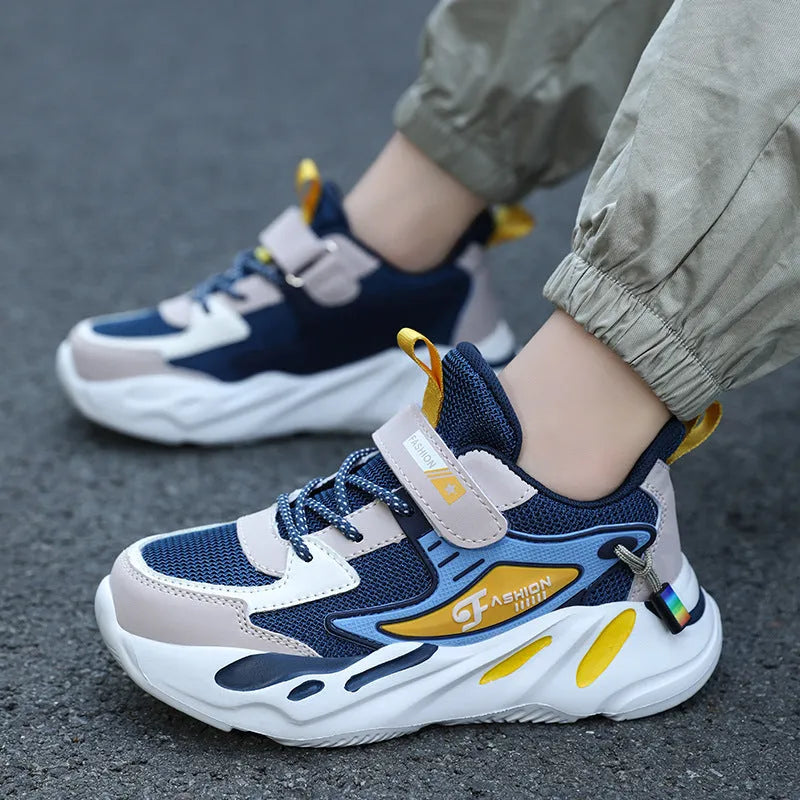 Boys' blue and black Velcro fastening sports shoes with a textured non-slip sole.