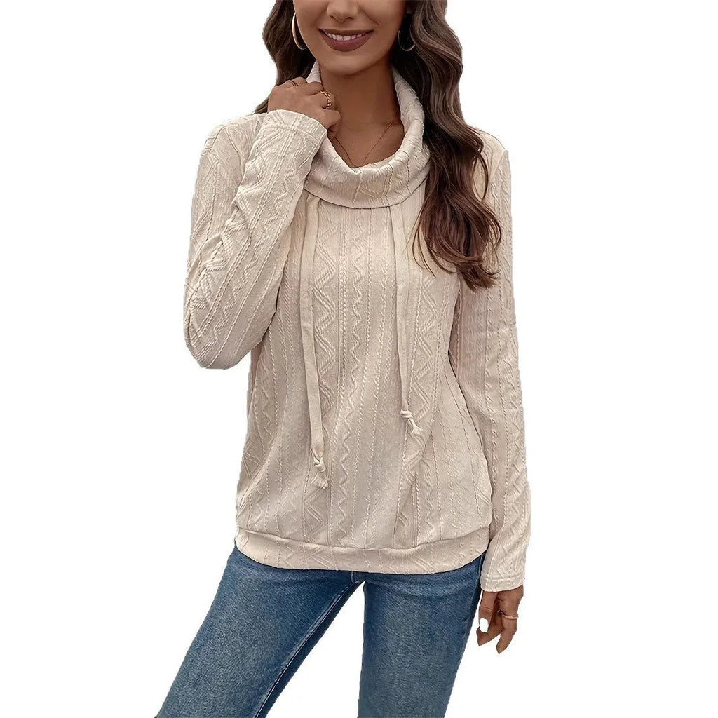 Apricot coloured hooded pullover sweater with long sleeves and a drawstring on the hood.