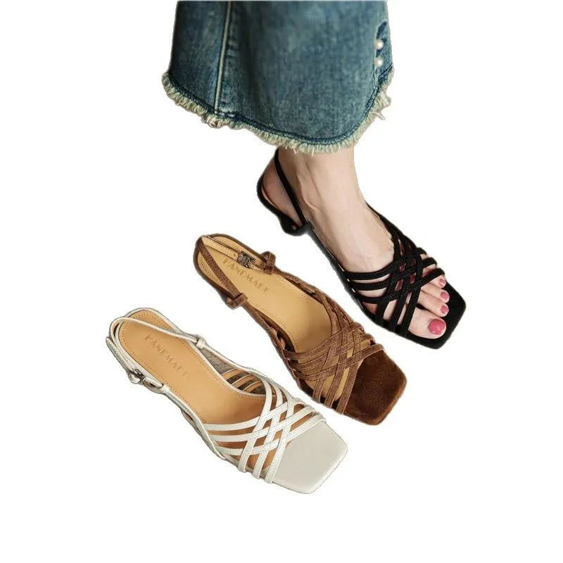 Retro soft brown women's sandals with thin cross straps, a mid-heel, and an ankle buckle on a white background.