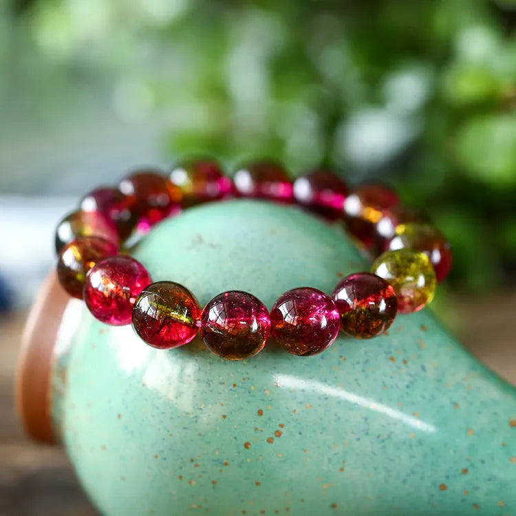 Women's watermelon crystal bracelet showing pink and green natural stone beads in selected size on wrist