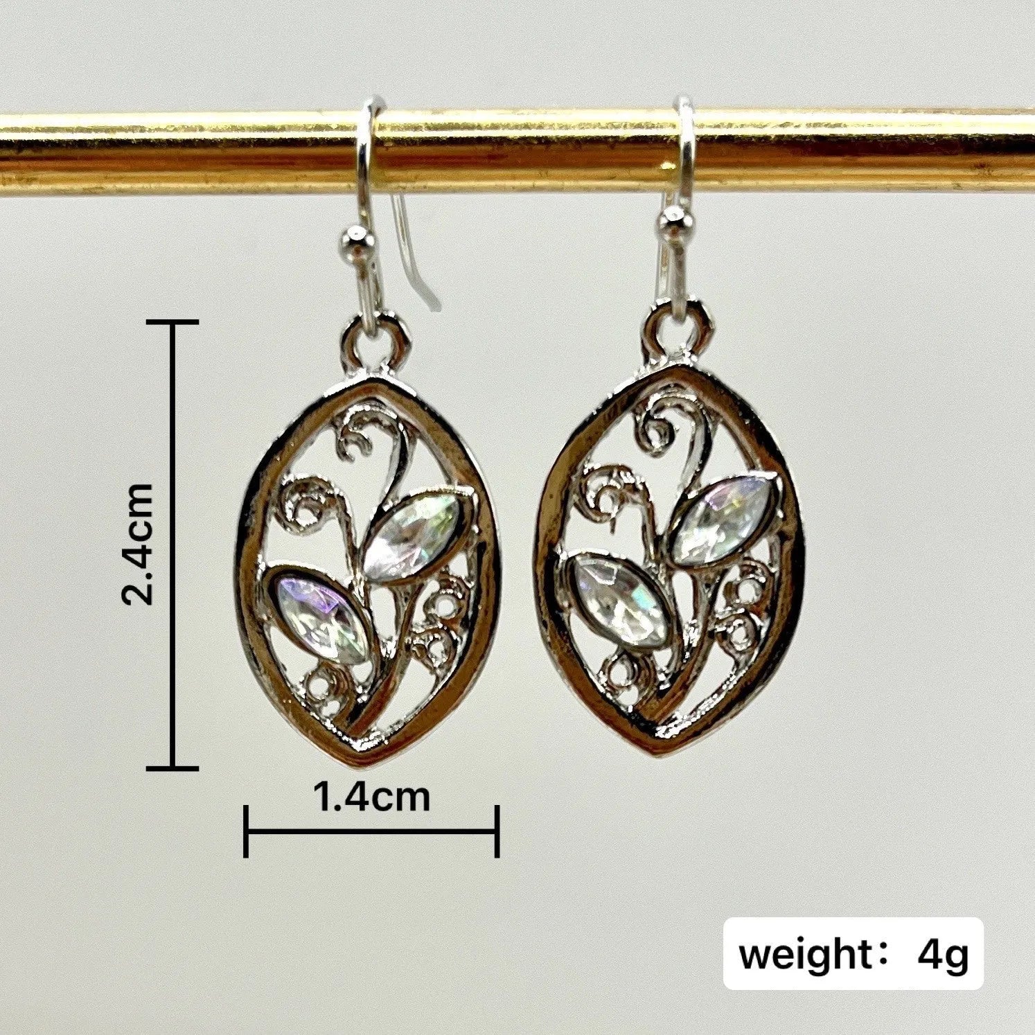 Silver leaf-shaped earrings with embedded colourful moonstones on alloy stud backs
