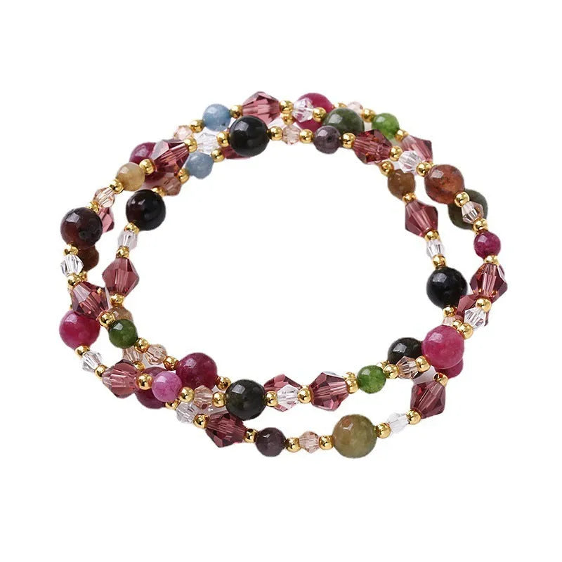 Women's adjustable bracelet with three rings of tourmaline, strawberry quartz or amethyst crystal beads on knotted cord