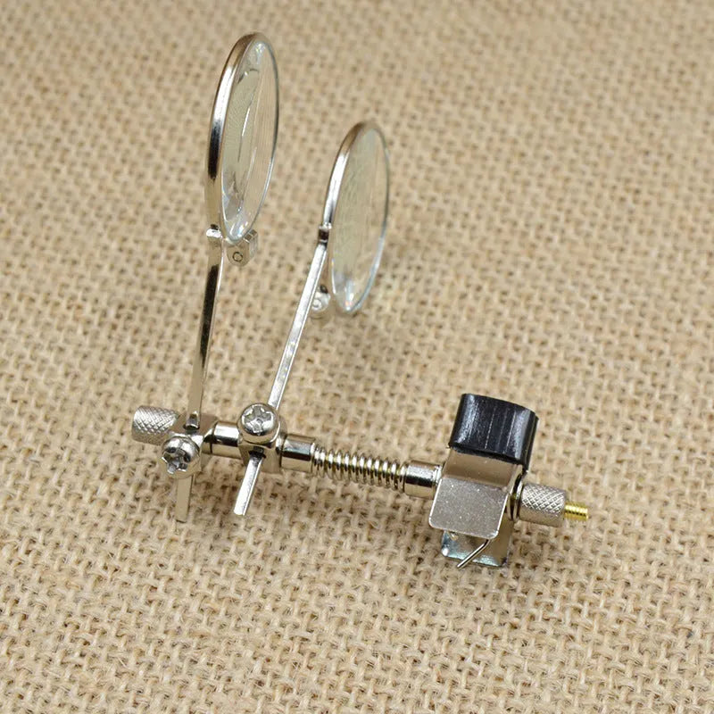 Reading glasses mirror clip attachment with double metal clips and glass auxiliary lenses.