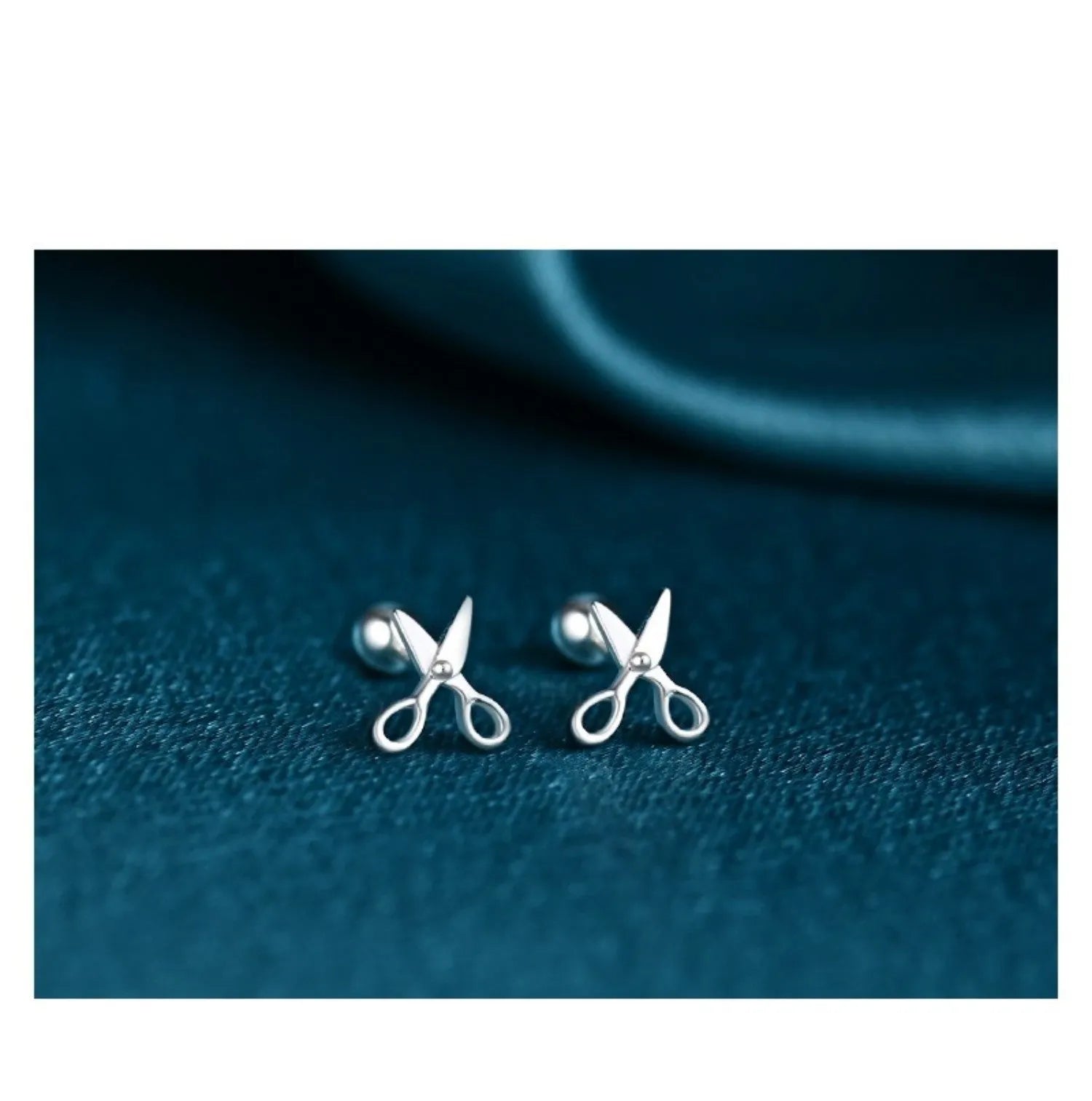 A pair of S999 pure silver screw ear nails with a mini scissors motif.