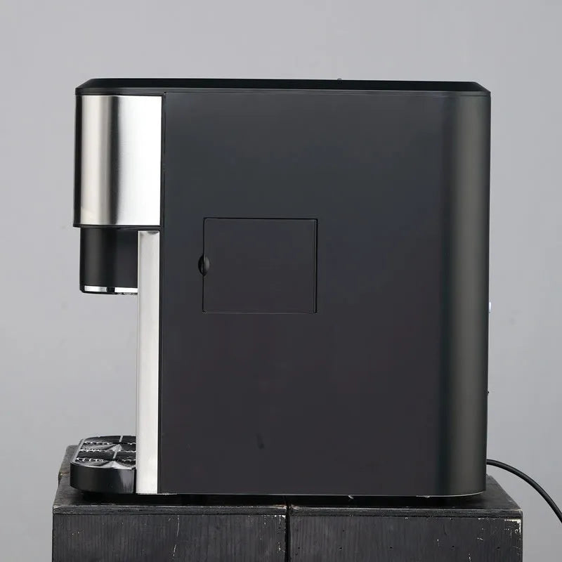 Black desktop ice maker with stainless steel trim showing ice production and water dispensing functions