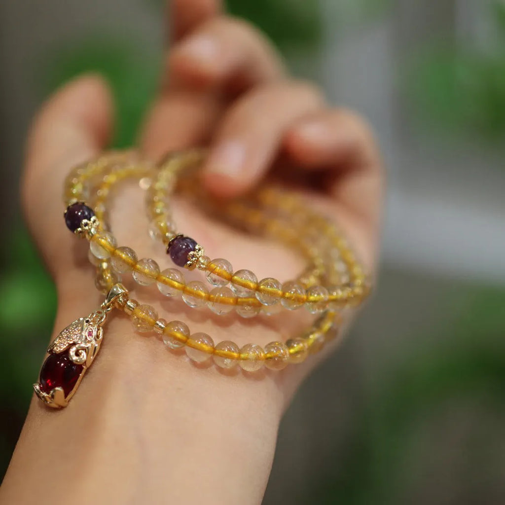Natural Brazil gold rutilated quartz bracelet with three ring gold design and Chinese style manual crafted beads