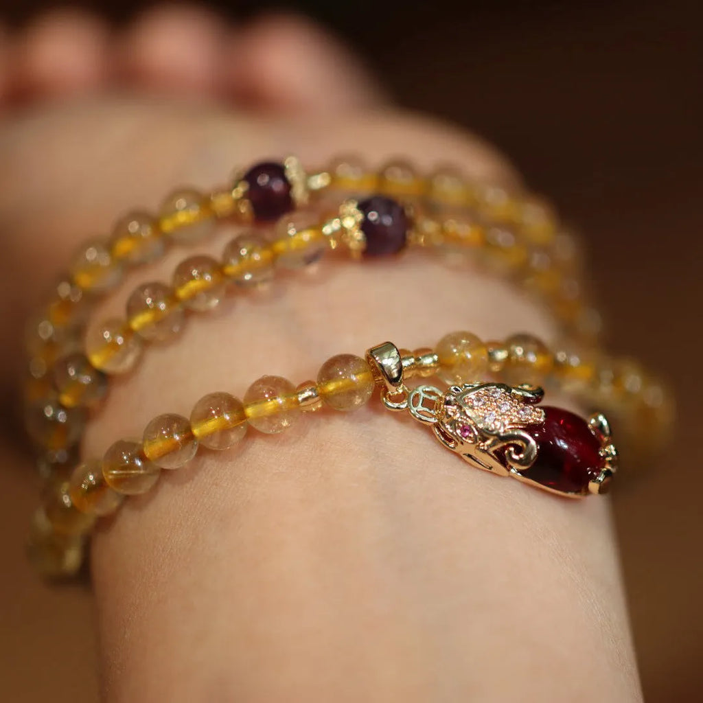 Natural Brazil gold rutilated quartz bracelet with three ring gold design and Chinese style manual crafted beads