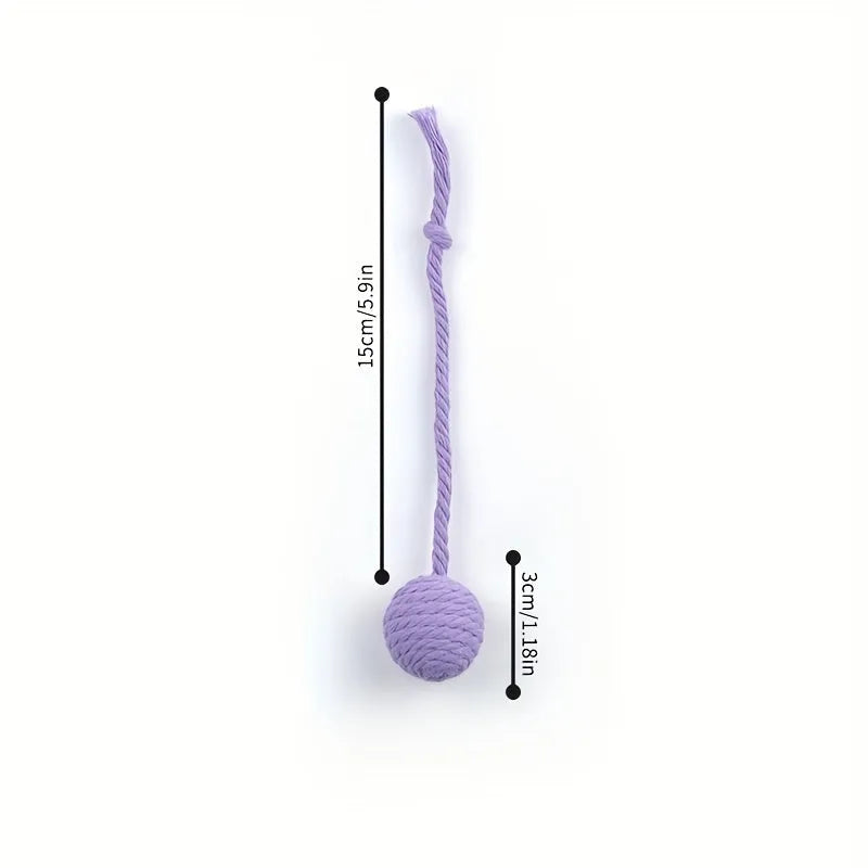 Green cat toy ball with a rope handle looped through it, shown next to a smaller pink version.