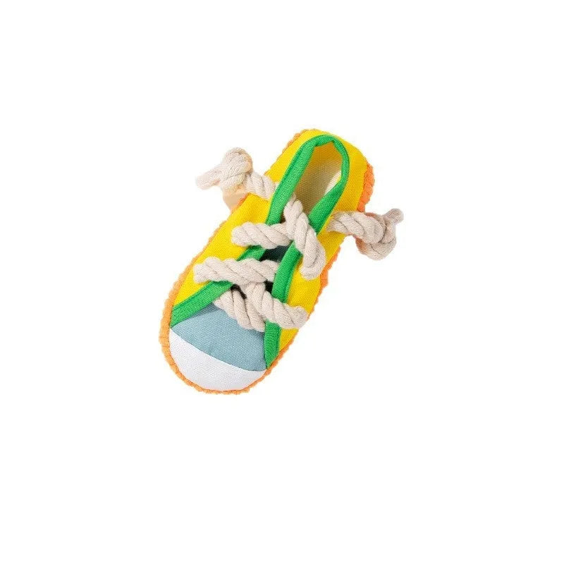 Slipper-shaped plastic dog chew toy in three colours with bends for chewing