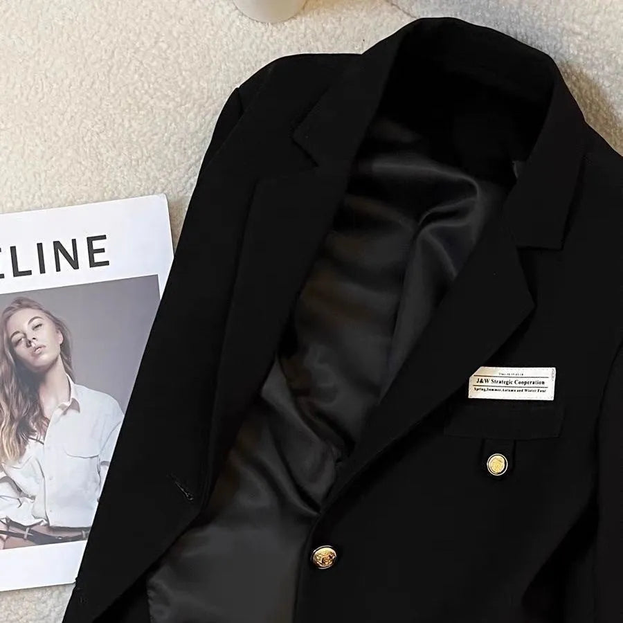 Women's black polyester short suit coat with loose fit and side pockets