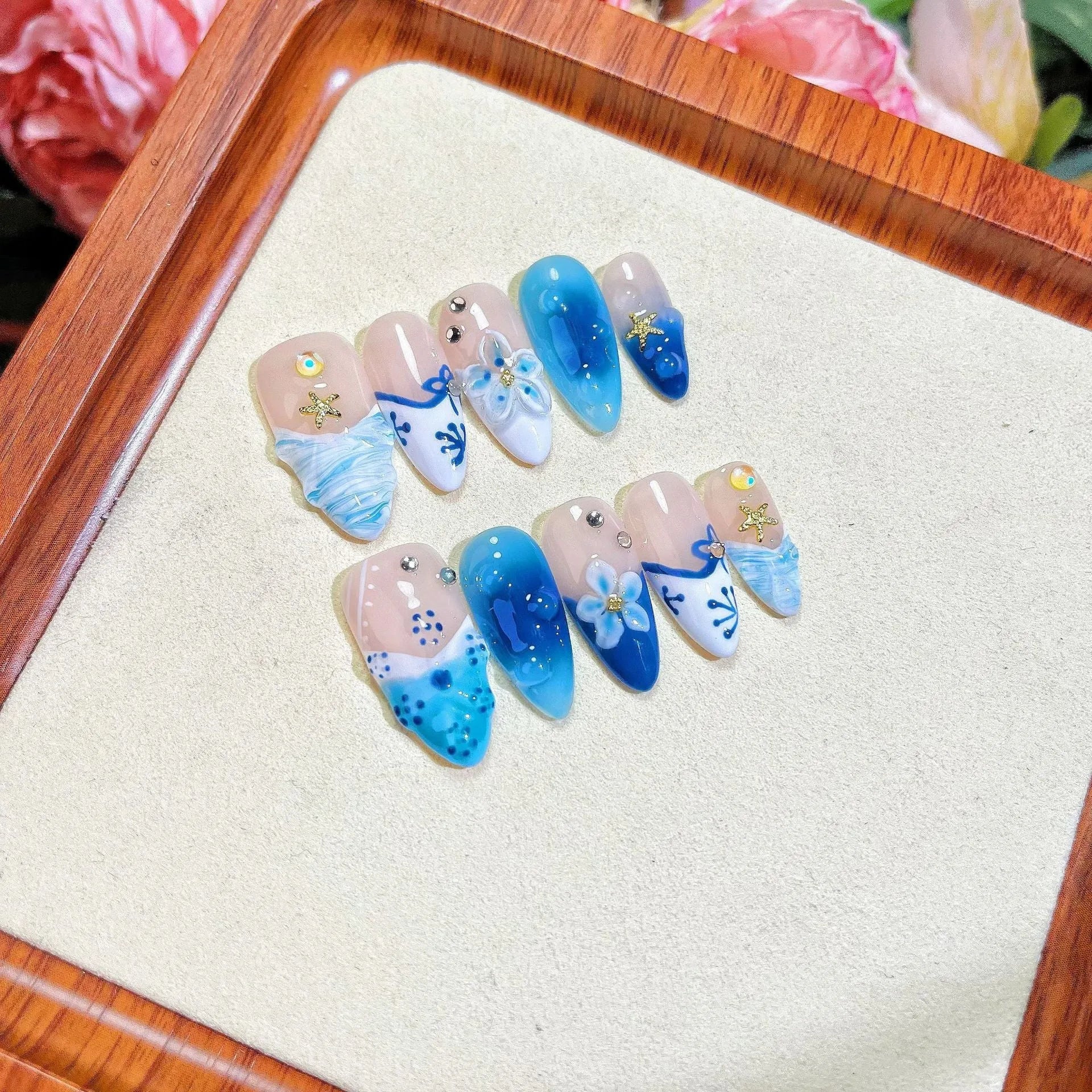 Blue hand-painted carved summer ice transparent plastic fake nails set in sizes XS, S, M, L