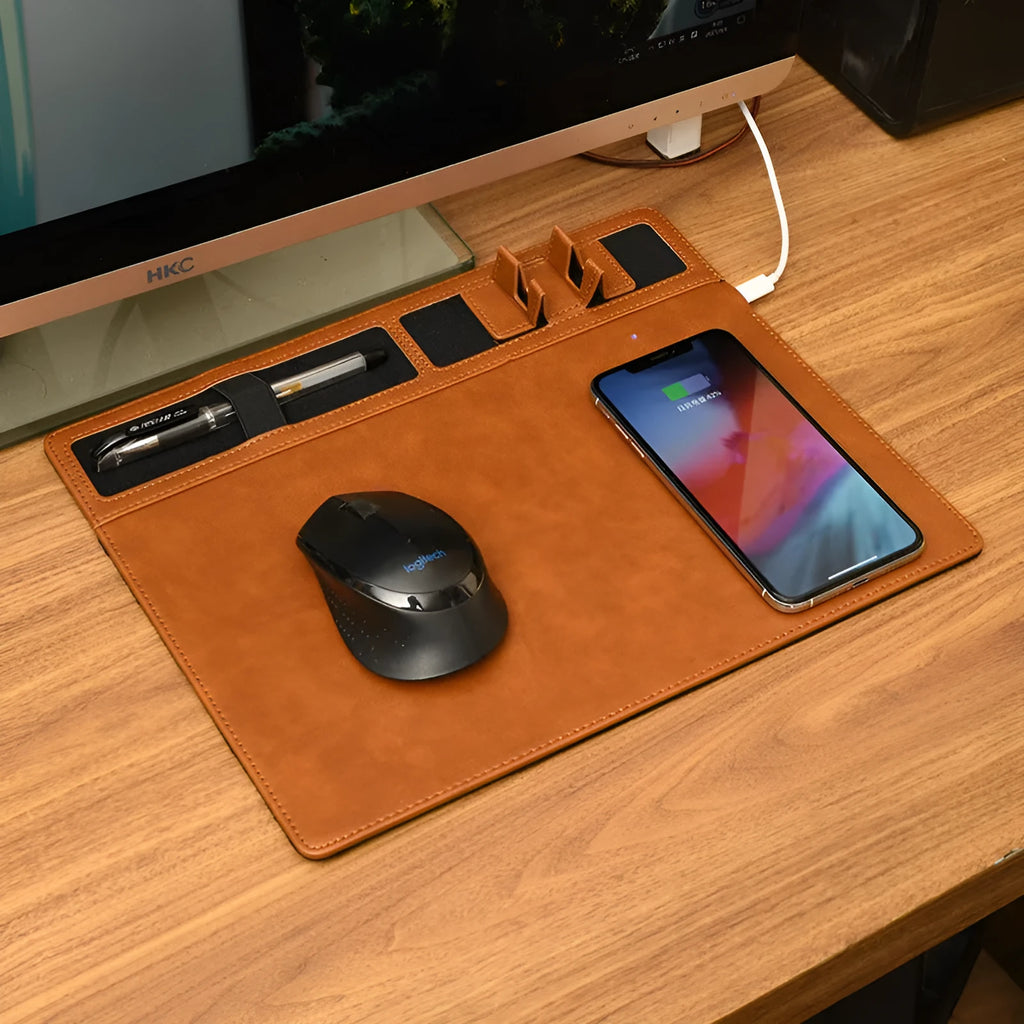 Pink wireless charging mouse pad with phone holder on a desk, dimensions 320mm by 260mm.