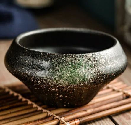 Ceramic tall Japanese soup noodle bowl in a retro glaze colour on a wooden table.
