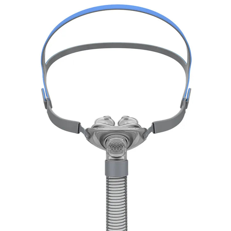 Ventilator nasal pillow mask with silicone cushion and headband components displayed in English packaging