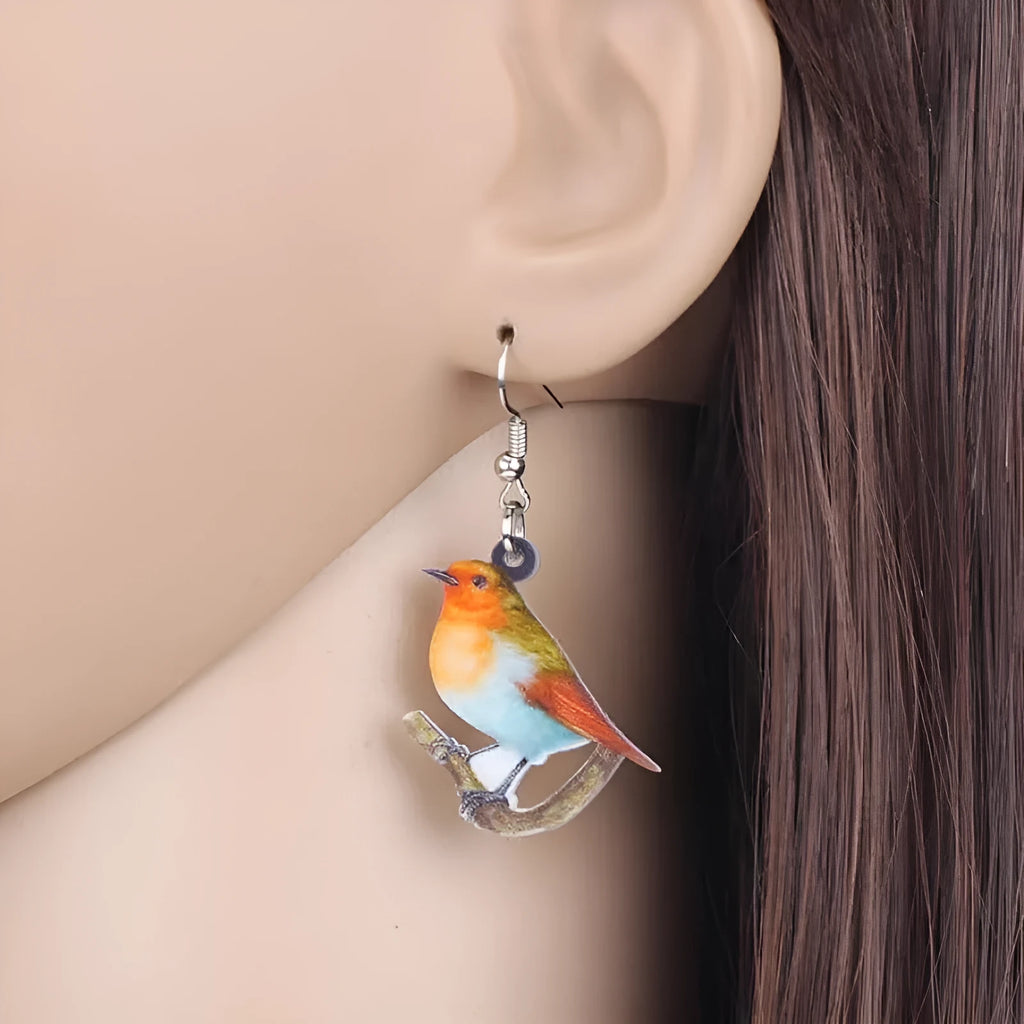 Blue titmouse pendant earrings with snake motifs on acrylic material