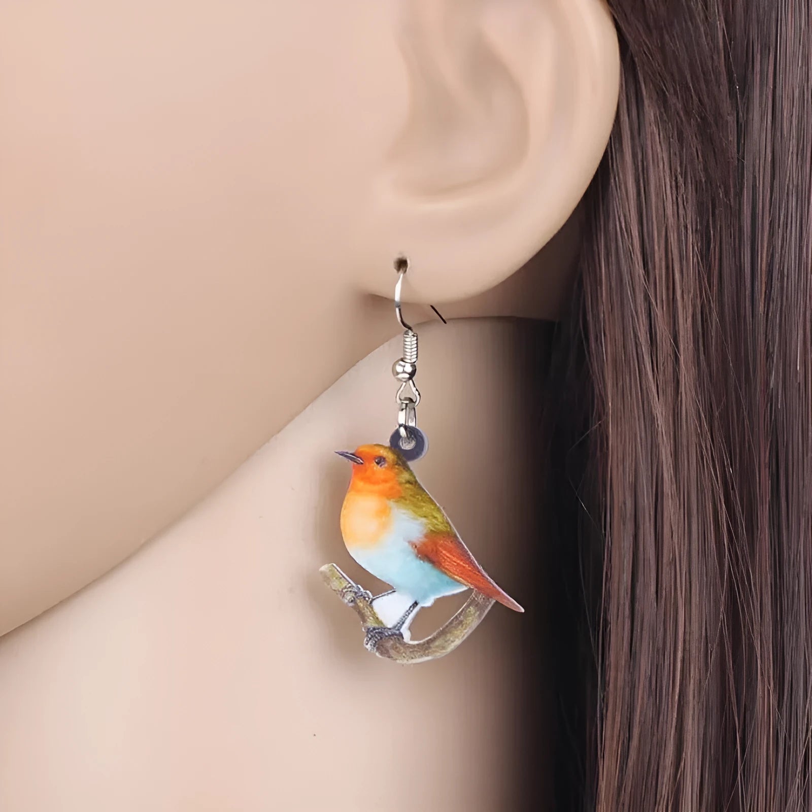 Blue titmouse pendant earrings with snake motifs on acrylic material