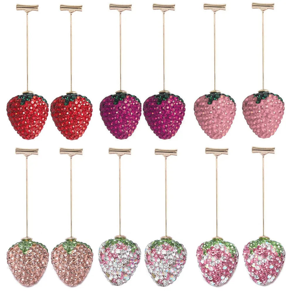 Geometric strawberry-shaped alloy earrings with spot-drill texture, shown in red colour.