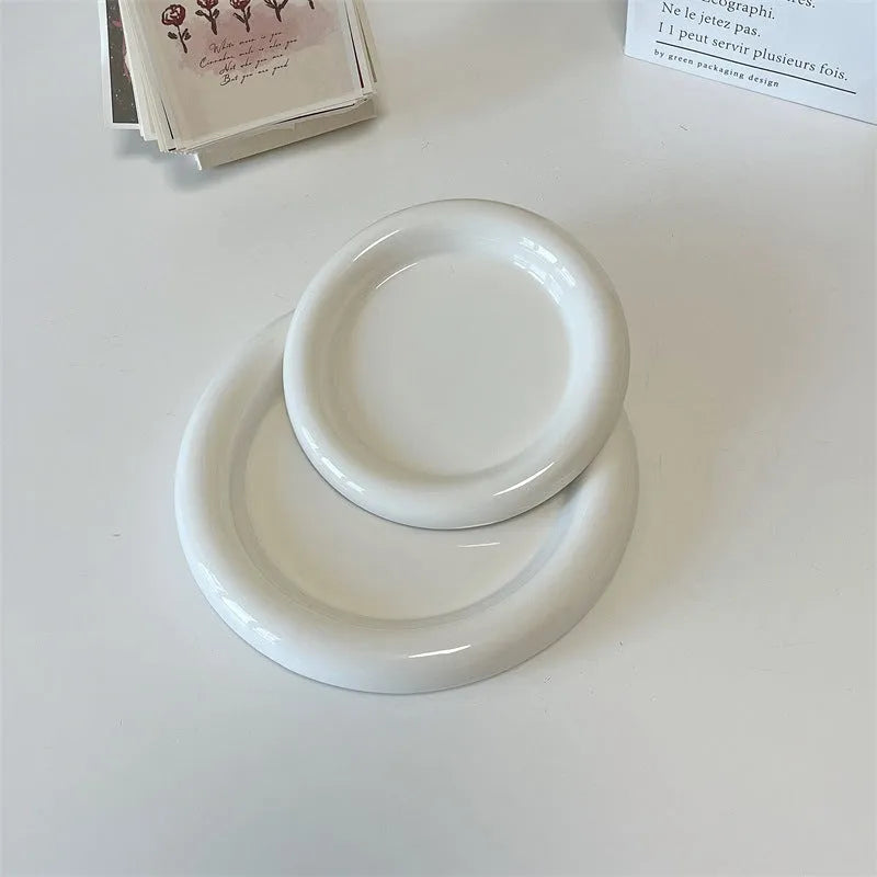 White ceramic plate with bear doodle design, 20cm diameter, on a table.