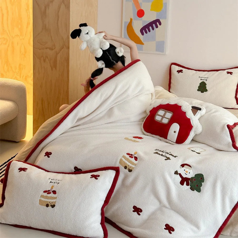 Cartoon winter-themed children's bedding four-piece set with duvet cover, sheet, and pillowcases.