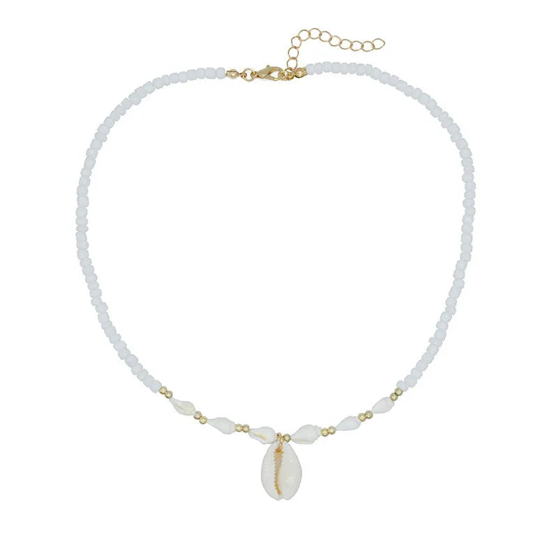 White conch shell necklace with mother of pearl pendant and beads on a chain.