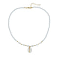 White conch shell necklace with mother of pearl pendant and beads on a chain.