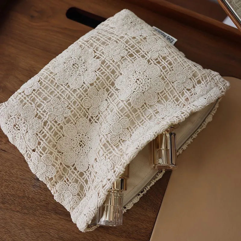 Handmade corduroy cosmetic bag with crocheted hollow flowers and ethnic embroidery, rope handle