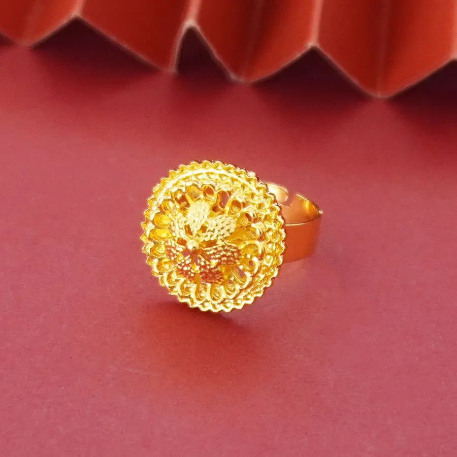 Gold-plated three-piece jewellery set with floral designs including necklace, earrings, and ring