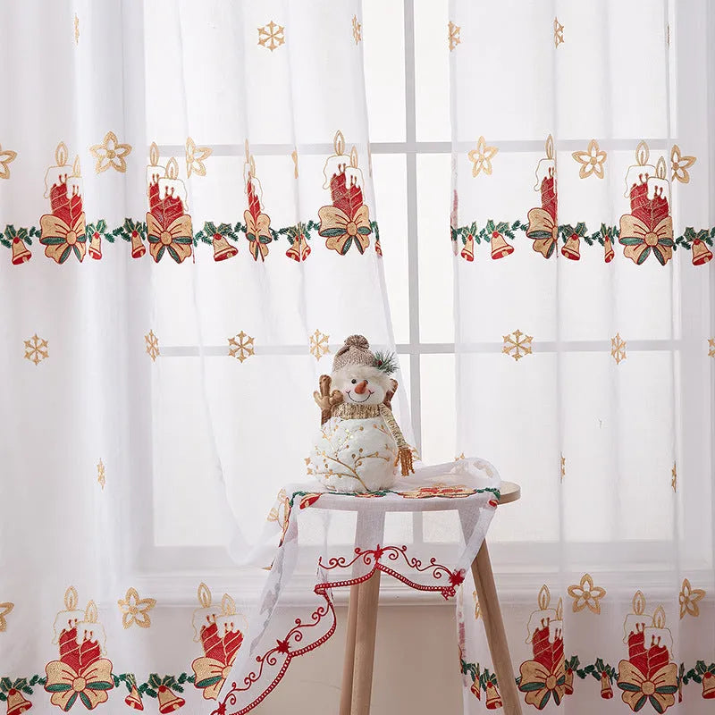 Christmas curtains with white snowflake embroidery on red polyester fabric hanging in window