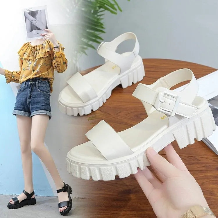 Beige women's platform sandals with peep toe and ankle strap buckle on a white background.