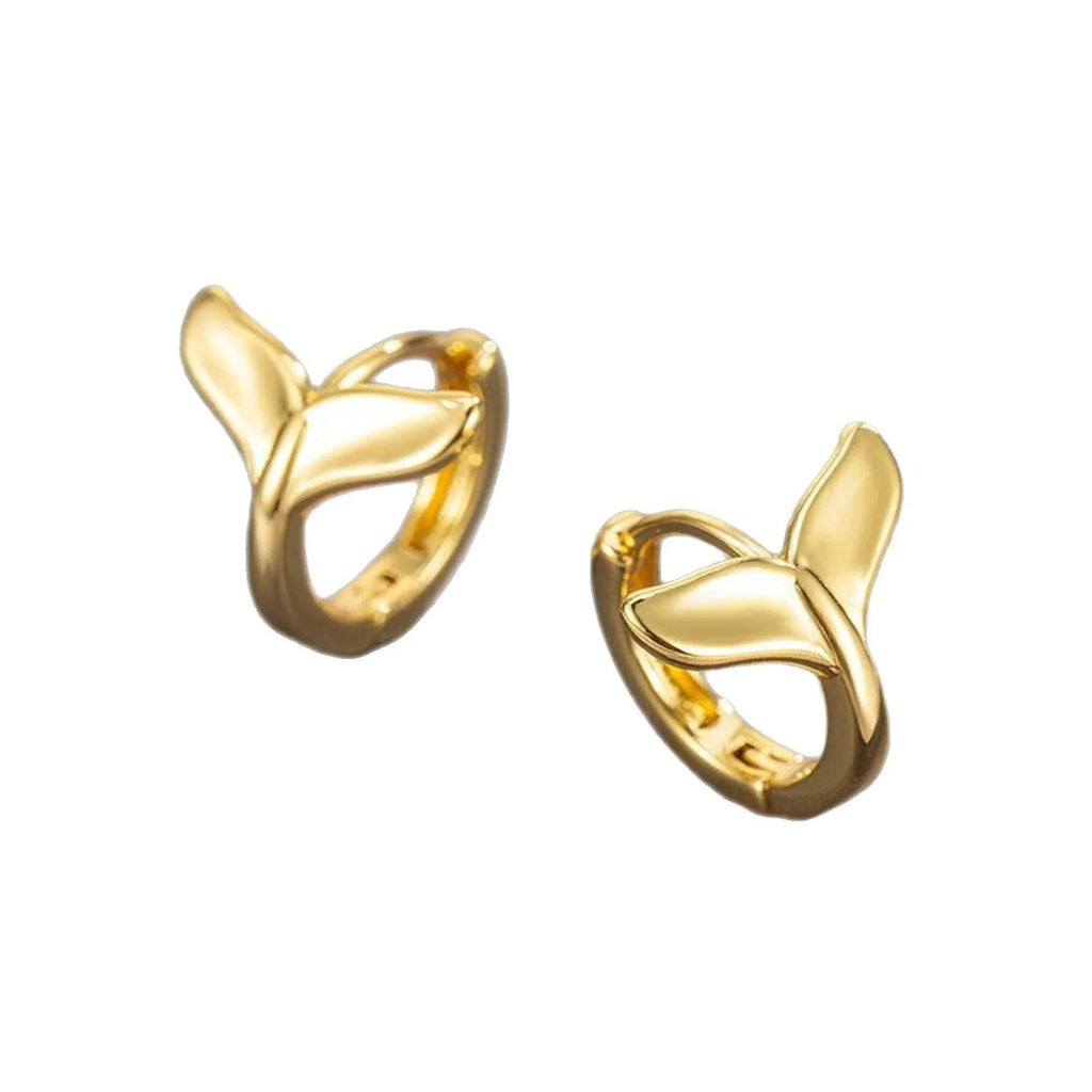 Women's fishtail design earrings in electroplated White Gold colour on a white background.