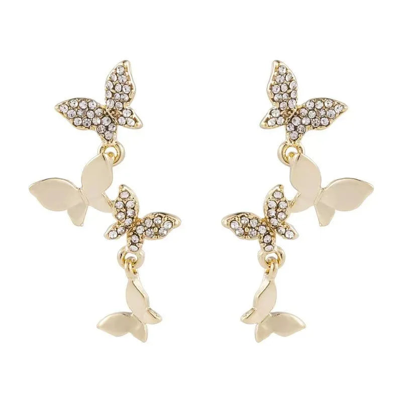Women's copper butterfly drop earrings with four motifs in gold colour