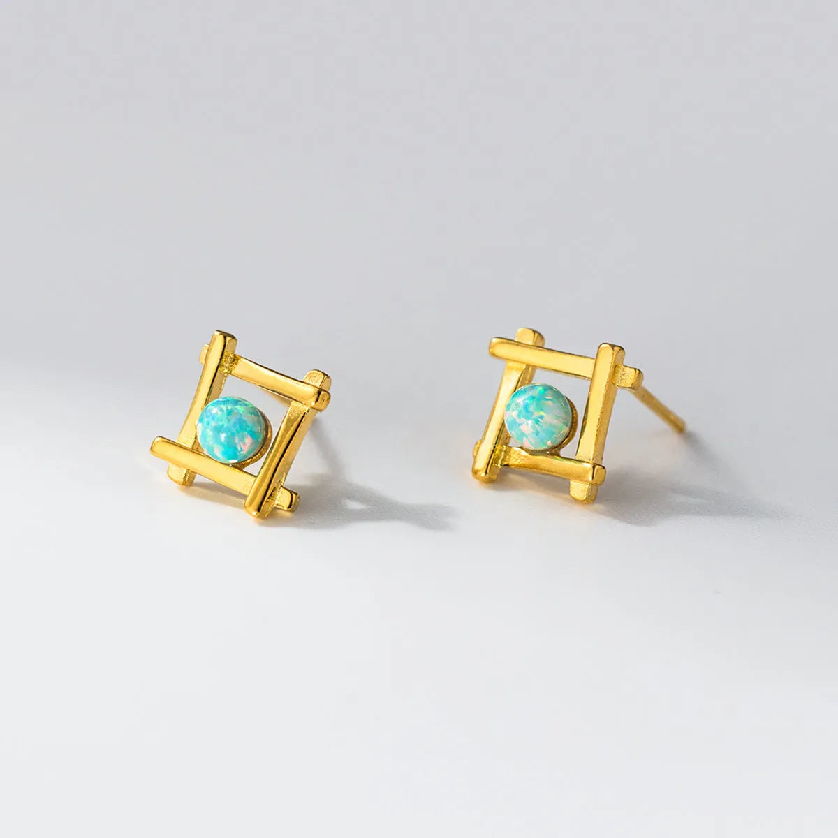 Geometric cross quadrangle stud earrings in sterling silver with gold or silver plating options