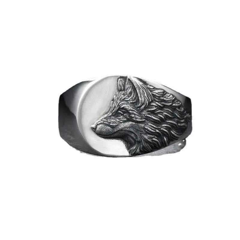 Men's silver geometric wolf head alloy ring on a dark background, showing detailed retro design.
