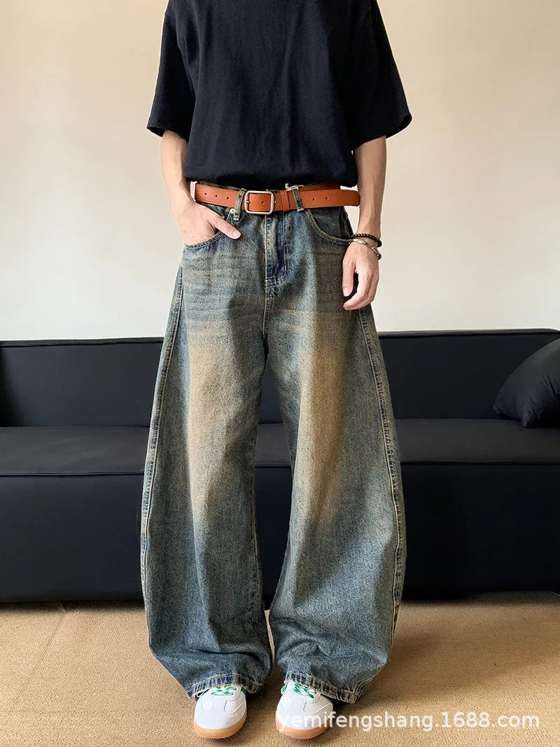 Men's retro blue distressed jeans with machete wash pattern and wide-leg design