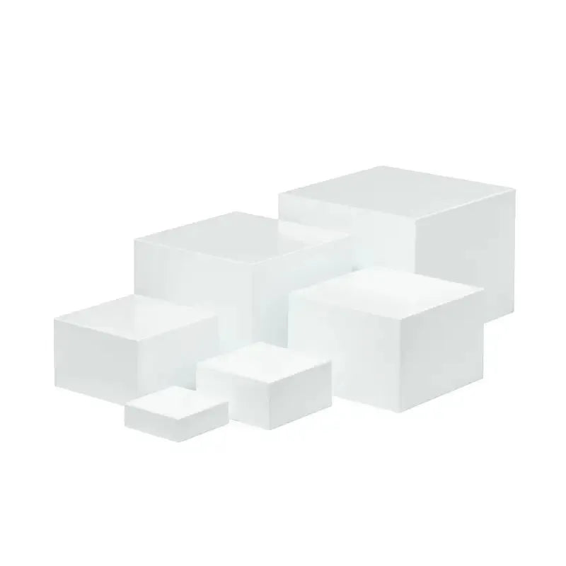 White and transparent plastic dessert display cube sets showing stackable 6-piece arrangements for cakes and pastries