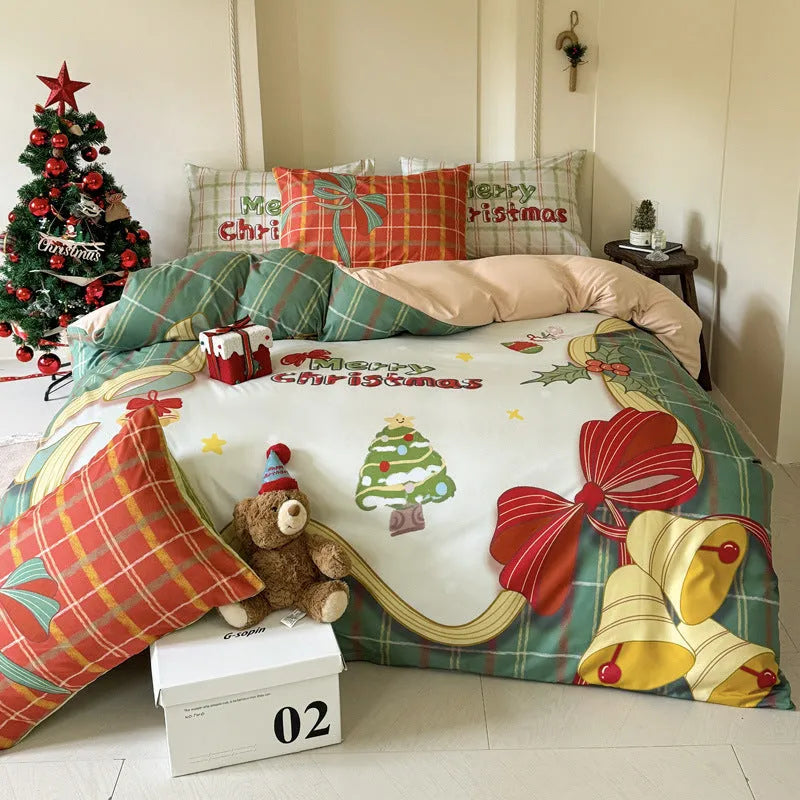 Christmas cartoon print bedding four-piece set showing sheet, duvet cover, and pillowcases.