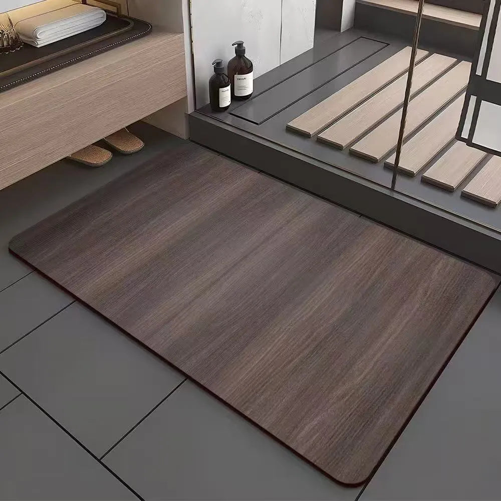 American-style square bath mat with wood grain pattern on a bathroom floor.
