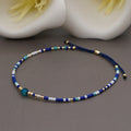 Handmade bohemian style bracelet with semi-precious stone and glass beads in geometric pattern