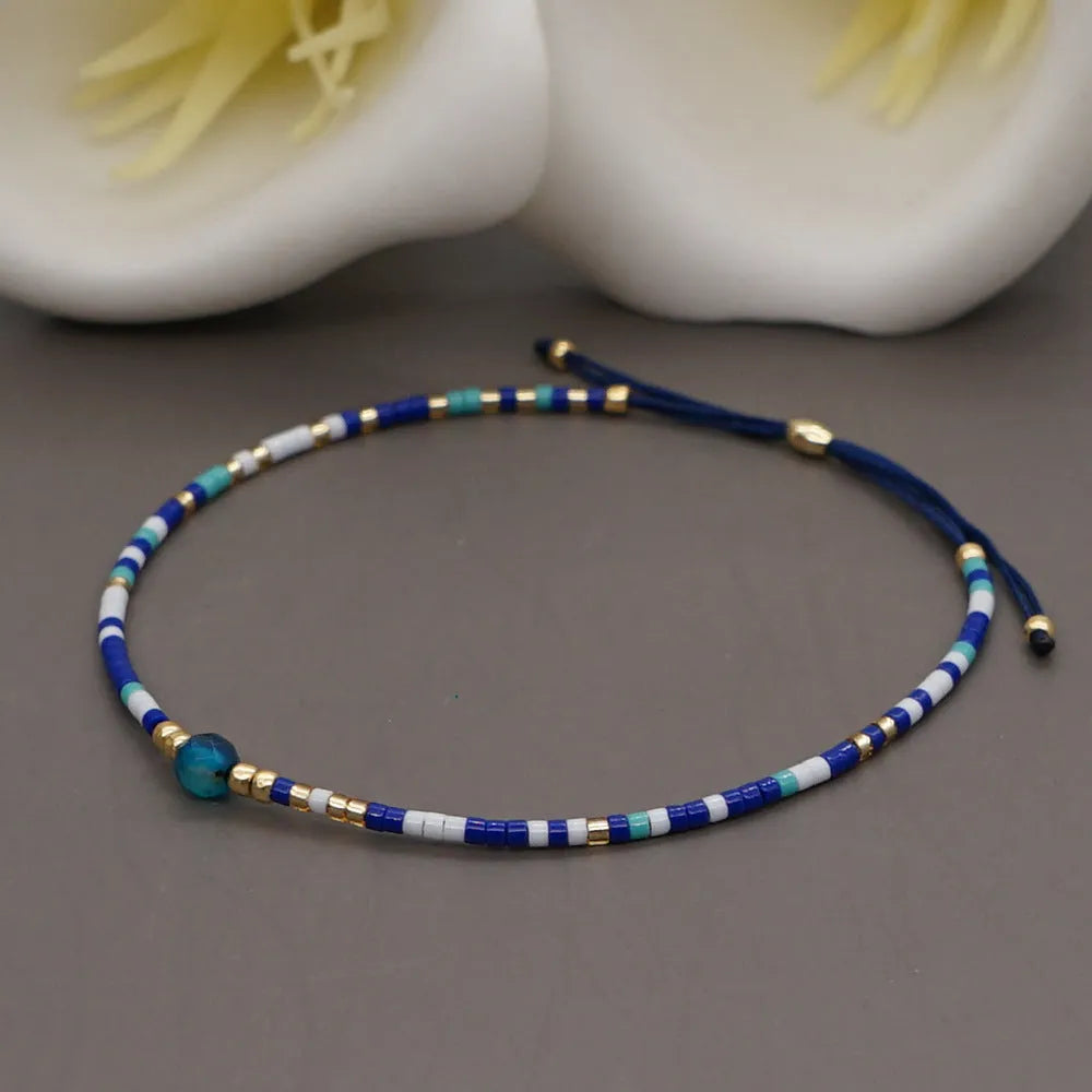 Handmade bohemian style bracelet with semi-precious stone and glass beads in geometric pattern