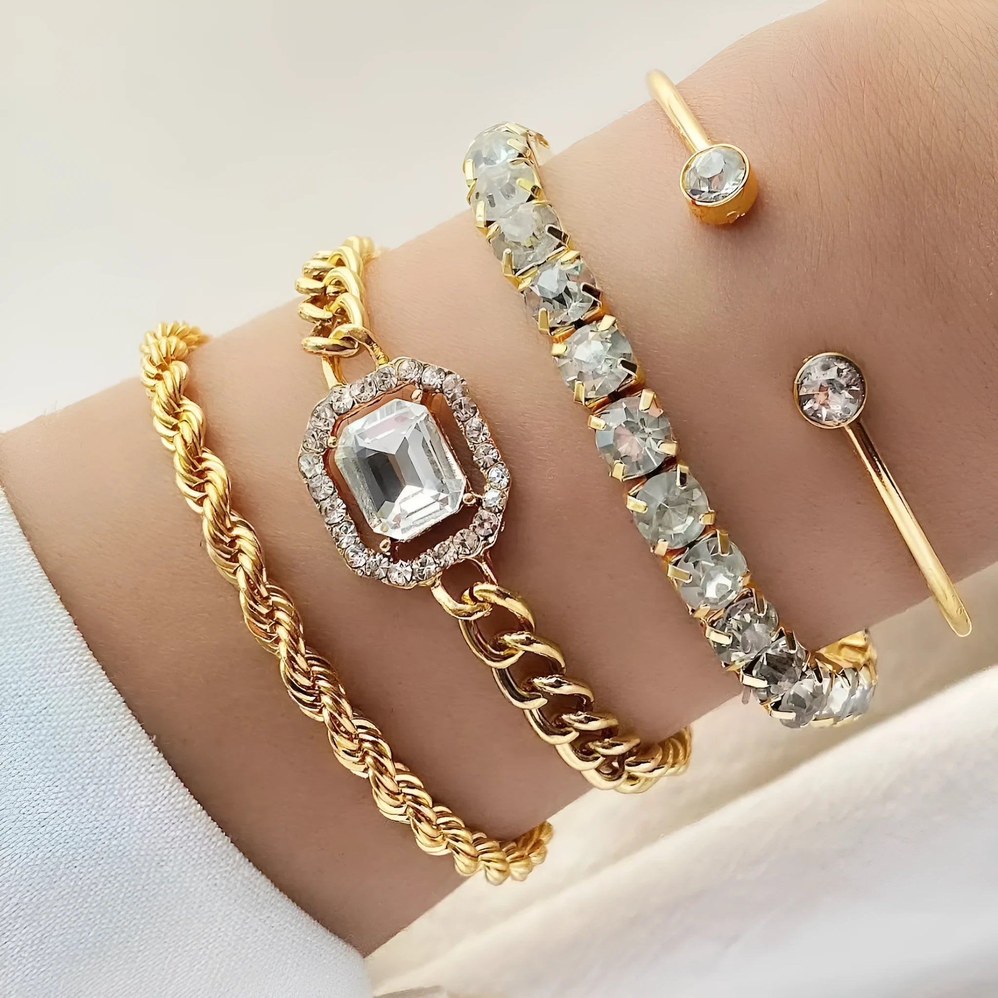 Four-piece retro metal chain bracelet set with square diamond geometric design in gold or silver tone alloy for women.