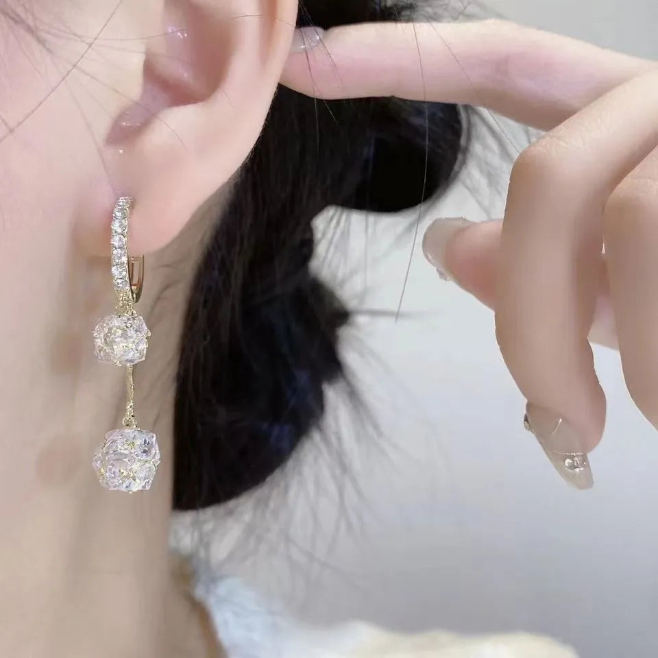 Women's silver drop earrings with confession balloon and rhinestone ball pendants and tassel detailing