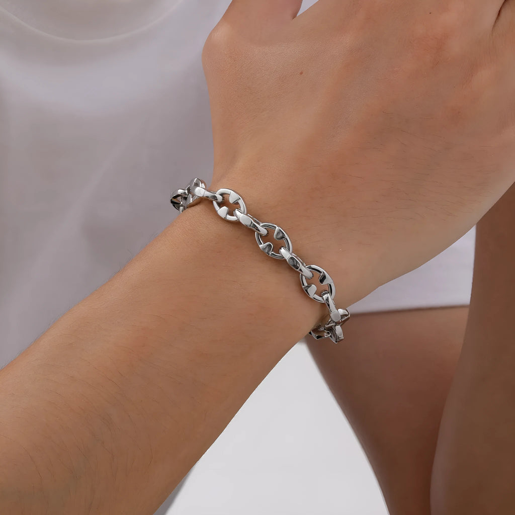 Men's stainless steel geometric link chain bracelet showing thick handmade construction