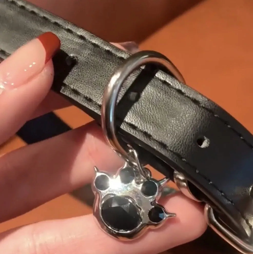 Black adjustable leather cat collar with bell charm showing three design options
