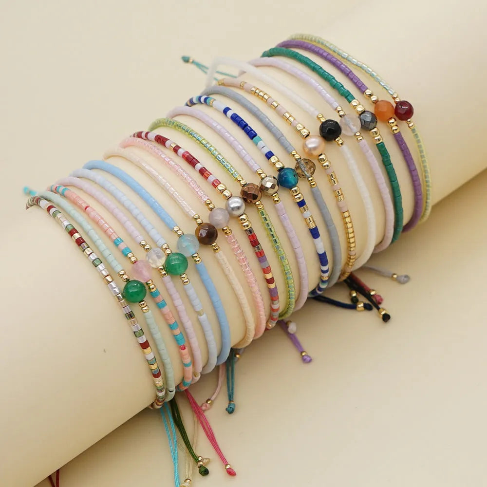 Handmade bohemian style bracelet with semi-precious stone and glass beads in geometric pattern