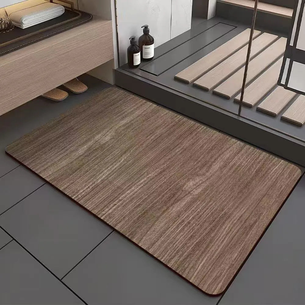 American-style square bath mat with wood grain pattern on a bathroom floor.