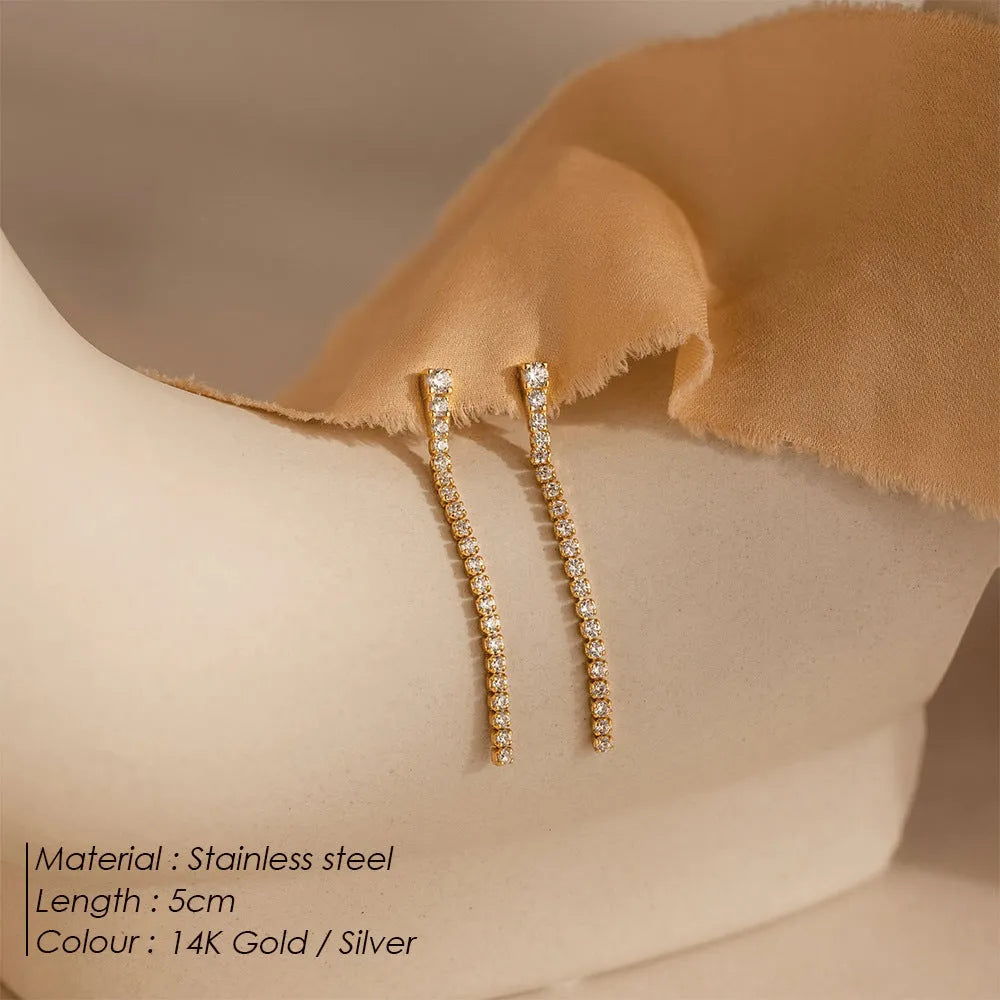 Geometric line design stainless steel earrings with zircon stones in gold and steel colour options.